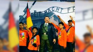 Auschwitz display- children posing Heil Hitler
